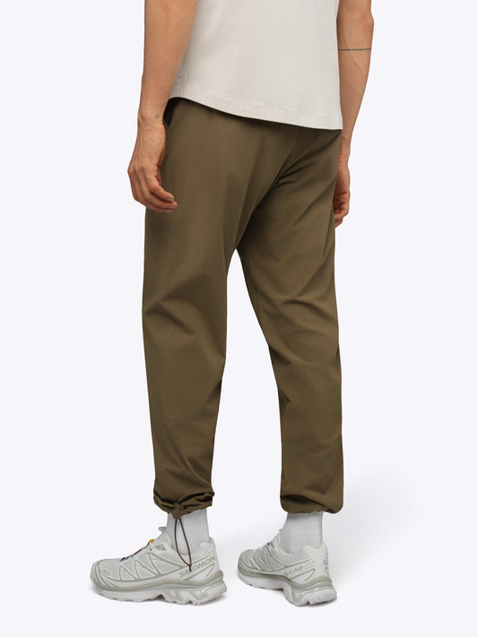 Men's Modern Slim Tech Trousers – Matte 4-Way Stretch Fabric, Hidden Cuff Cinch, Back Zip Pocket | Dark Khaki