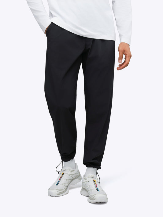 Men's Modern Slim Tech Trousers – Matte 4-Way Stretch Fabric, Hidden Cuff Cinch, Back Zip Pocket | Black