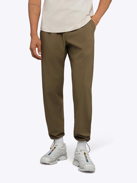 Men's Modern Slim Tech Trousers – Matte 4-Way Stretch Fabric, Hidden Cuff Cinch, Back Zip Pocket | Dark Khaki