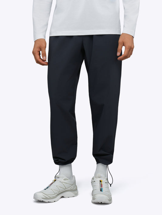 Men's Modern Slim Tech Trousers – Matte 4-Way Stretch Fabric, Hidden Cuff Cinch, Back Zip Pocket | Obsidian